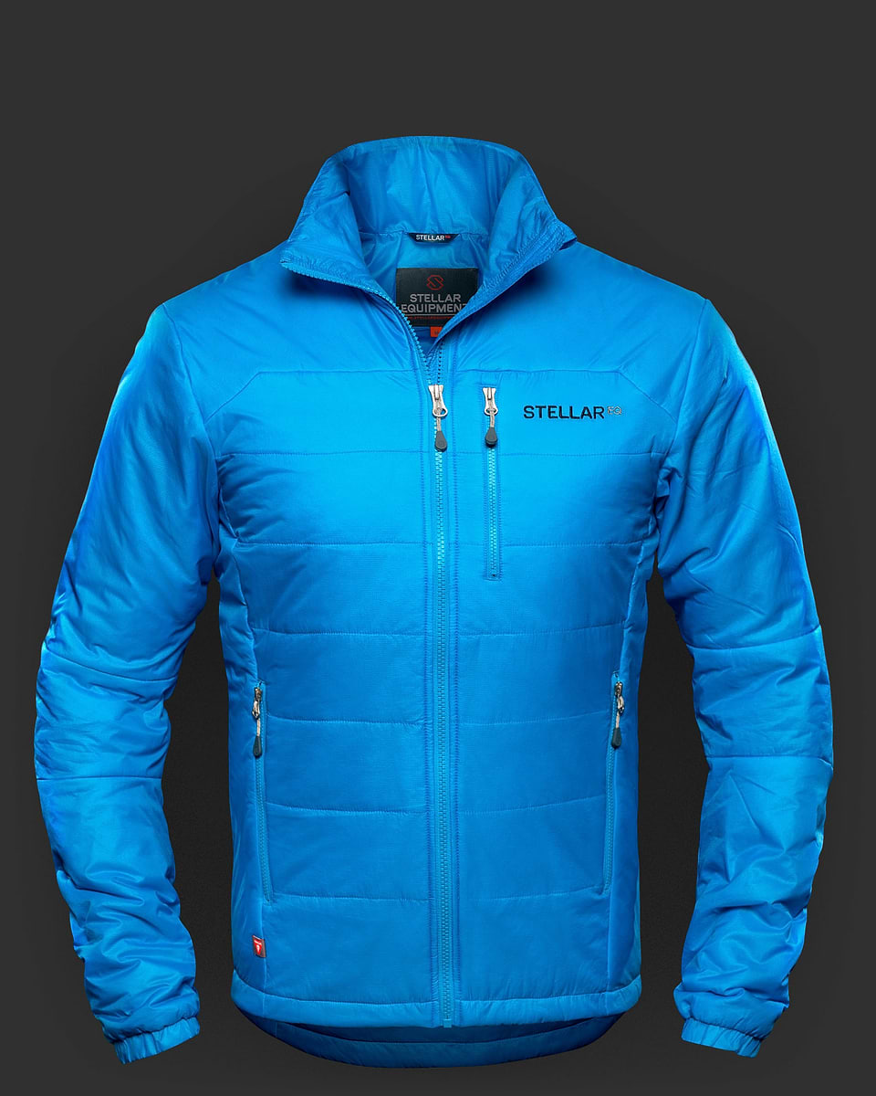Blue Stellar Equipment Primaloft jacket with hood. Revised and upgraded for 2019, this synthetic insulation jacket is very warm, very lightweight and very packable. Filled with PrimaLoft’s highest performing Gold Active ECO filament fibres, it is also very breathable.
