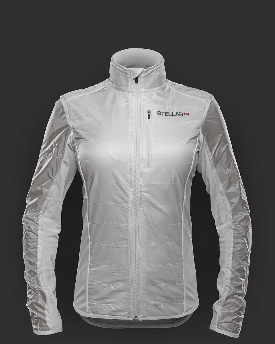 White hybrid wind jacket for women. Stellar Equipment. The Hybrid Jacket combines a windproof ultralight shell material with super stretchy Fieldsensor™ lightweight fleece fabric.