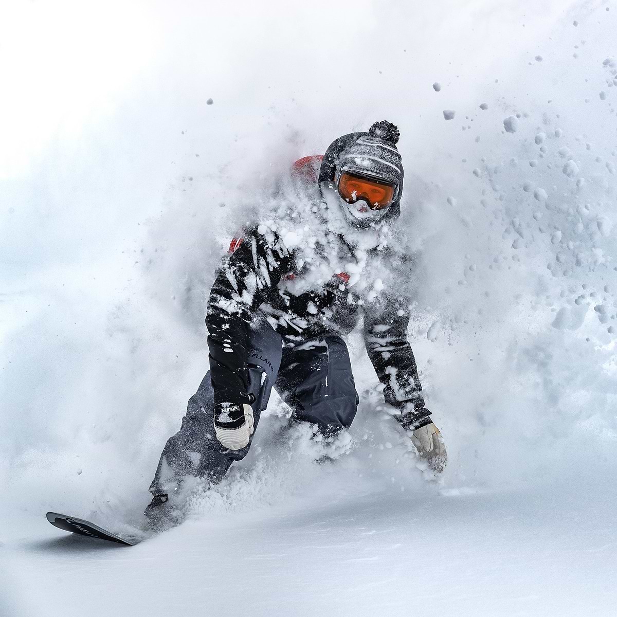 Cody Bramwell with a massive face shot in Engelberg, Switzerland. Wearing the Stellar Equipment Free System in Black + Grey.