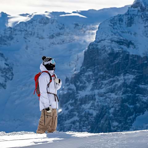 Cody Bramwell scoping lines in Engelberg, Switzerland. Wearing the Stellar Equipment Free System in White + Khaki.
