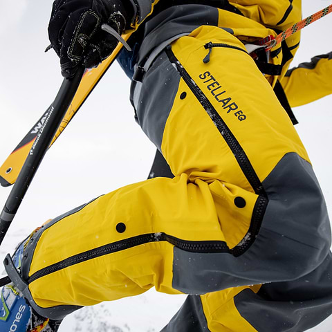 A close up of the Stellar Equipment Mens Guided Shell Pants 2.0 in Yellow. The photo was taken by Christoffer Sjöström in Verbier, Switzerland.