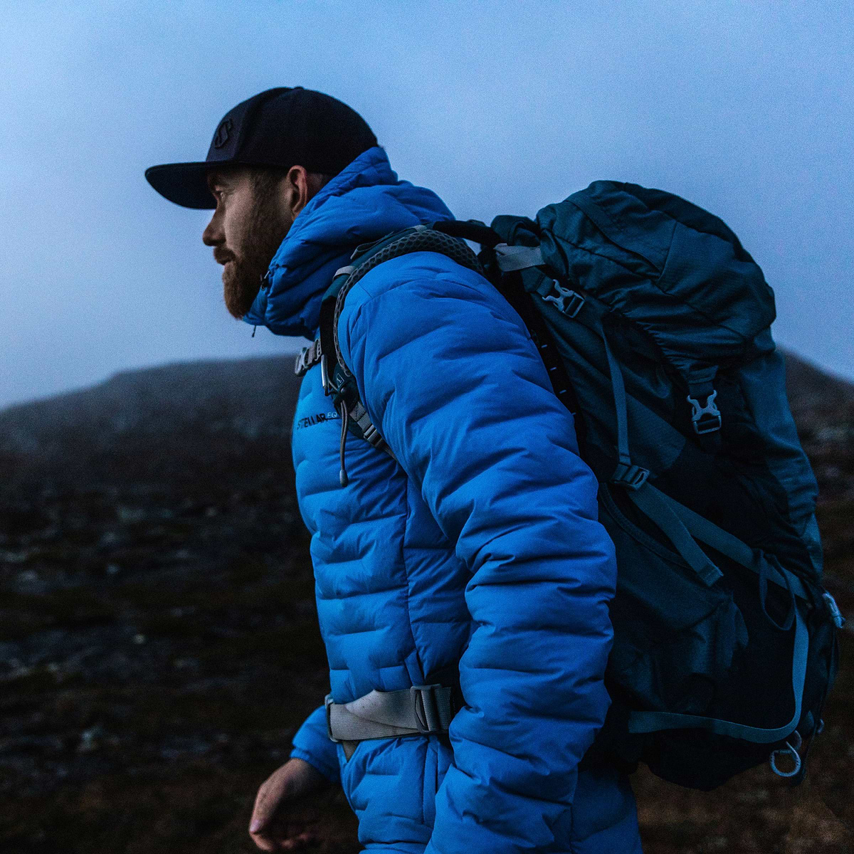 David Kantermo hiking in Åre, Sweden during dawn. Wearing the Stellar Equipment Stretch Down Hood in Blue.