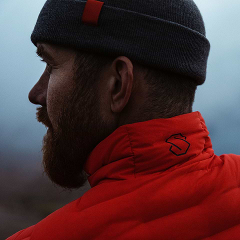 David Kantermo enjoying the view in Åre, Sweden during dawn. Wearing the Stellar Eq Stretch Down Jacket in Orange.