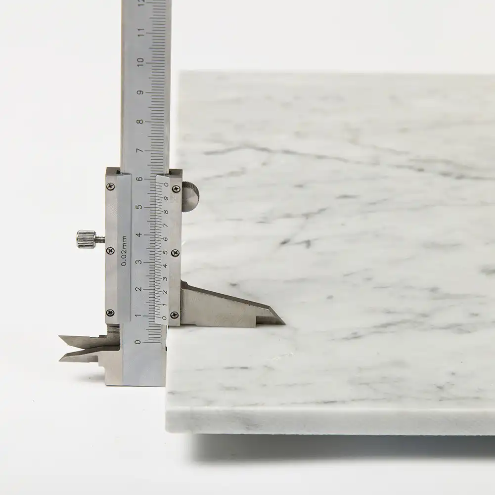 Measure of thickness in Bianco Carrara 12x24 Honed Marble Subway Tile
