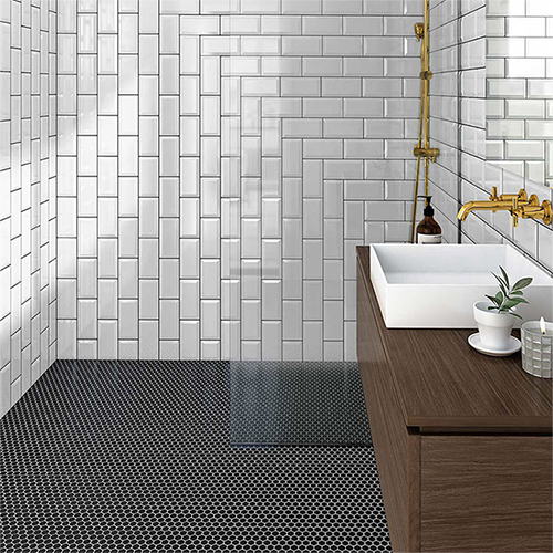 Bathroom shower floor with installed 1x1 Porcelain hexagon mosaic tile