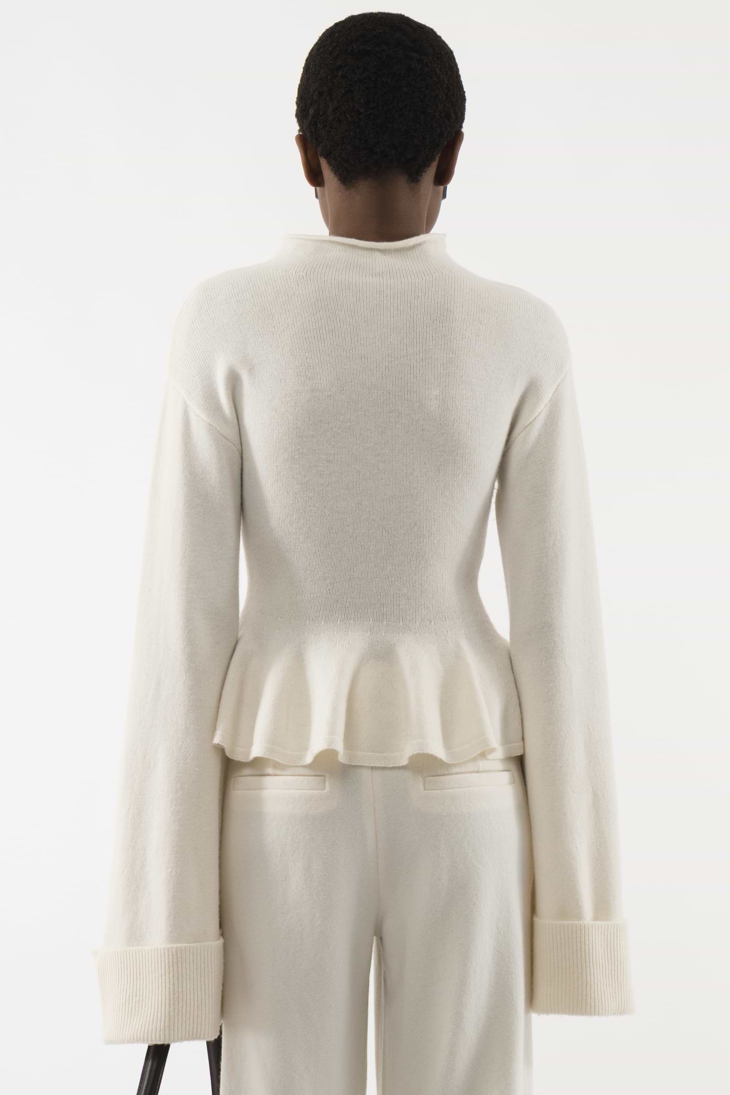 Knitted Relaxed Peplum Sweater - Arakii