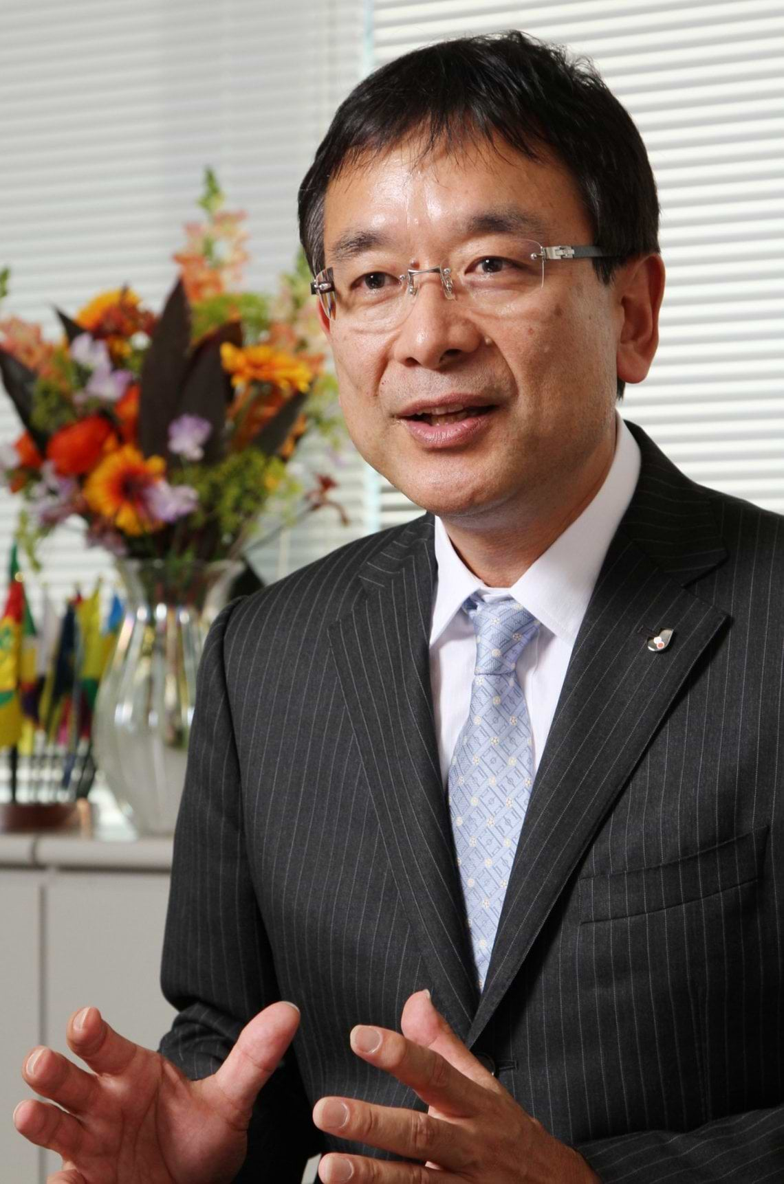 村井満氏